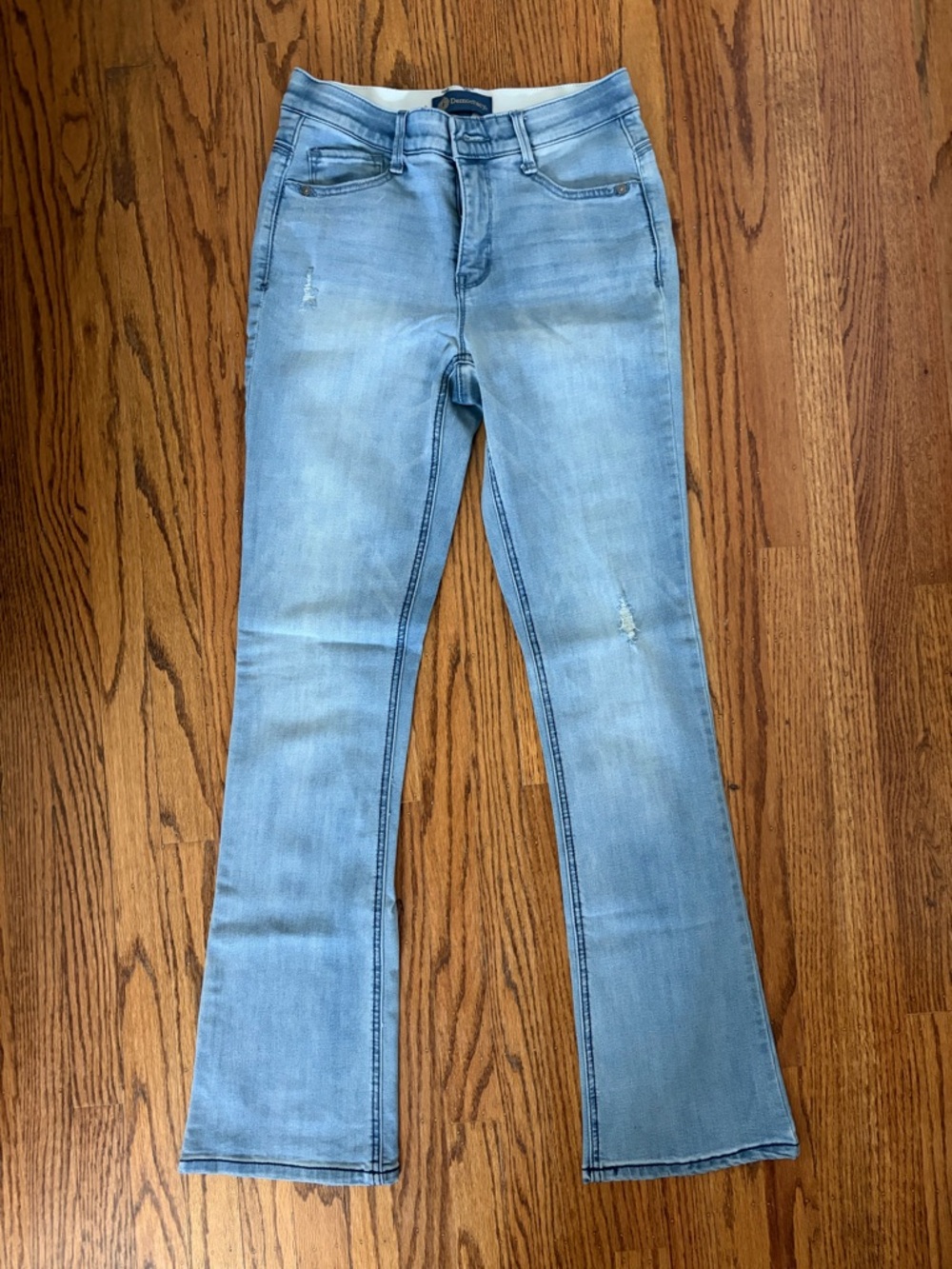 Democracy navy label on light blue denim